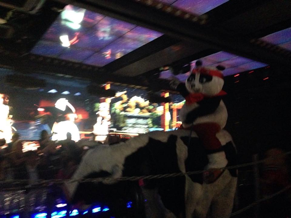 Kung-fu panda rides cow into battle at Robot Restaurant
