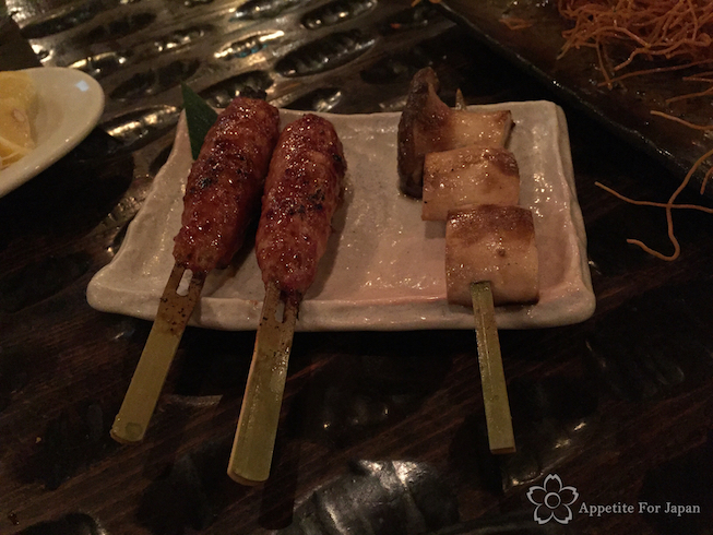 Tsukune ground chicken stick and Eringi mushroom sticks Gonpachi Shibuya Tokyo Japan